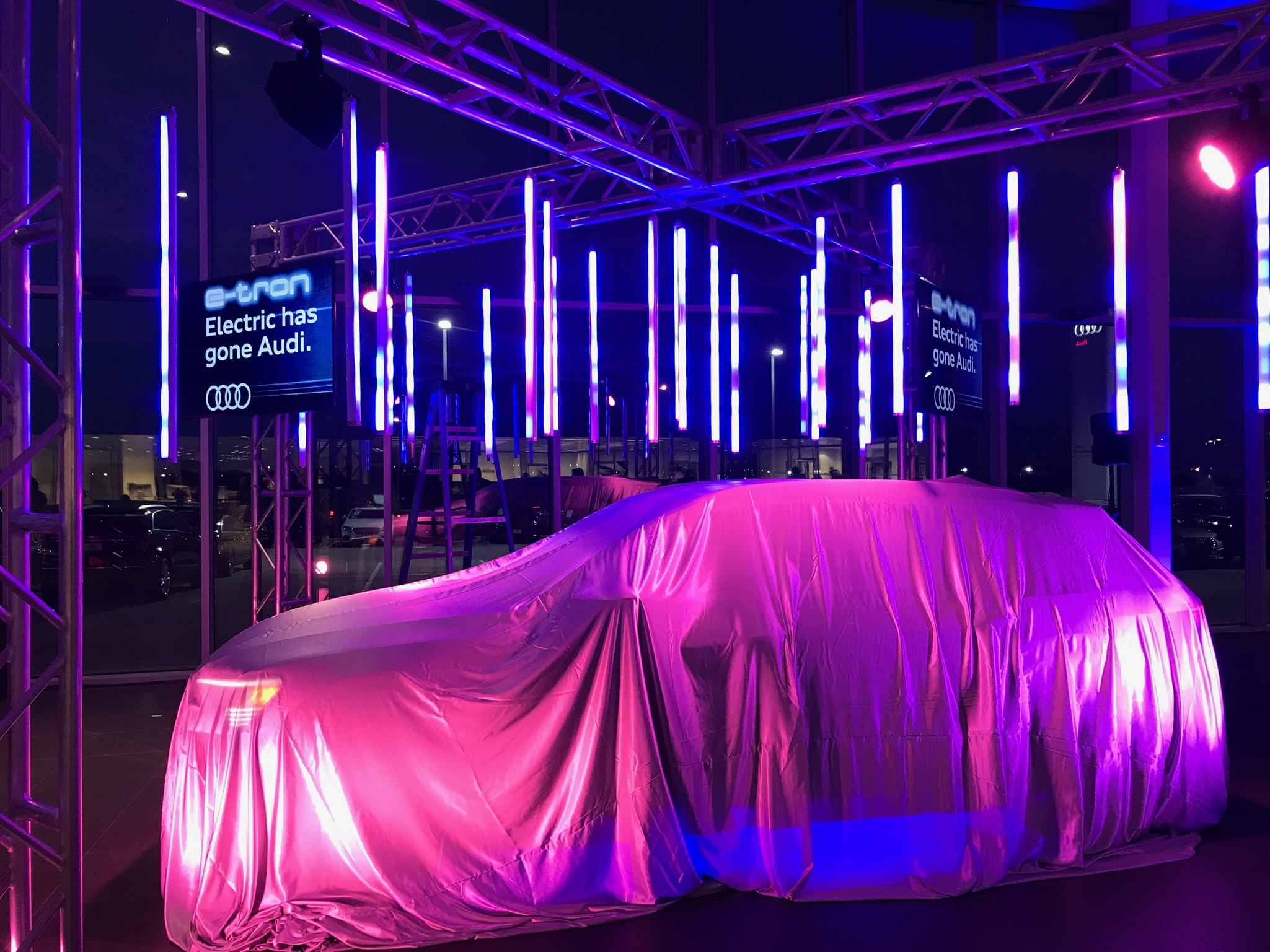 Audi eTron event with an Audi SUV under a blanket ready to be revealed.